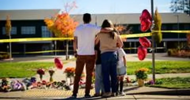 Oregono mokykloje mokytojas stojo į kovą su užpuoliku, kol ginkluotas tėvas jį pašovė kelis kartus